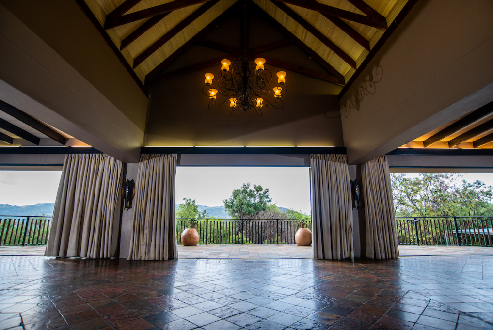 Lolola Hall 01 1017 x 681 - Thaba Eco Hotel The view from Lolola hall on to Thaba Eco Hotel, with high ceiling and a chandelier
